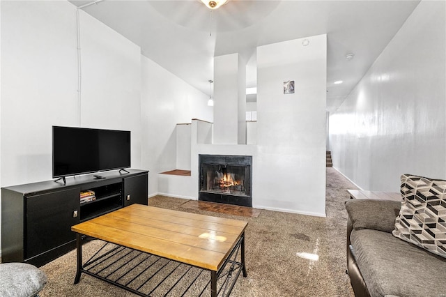 2021 S 8th St, Saint Louis, MO 63104 - living room featuring a lit fireplace, carpet flooring, ceiling fan, baseboards, and a high ceiling