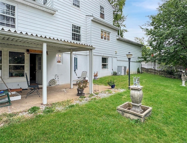 520 N Main St, Louisiana, MO 63353 - back of house with central air condition unit and a patio