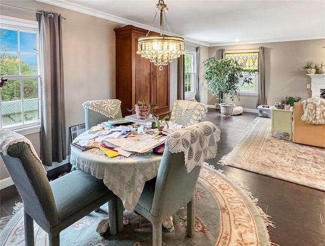 520 N Main St, Louisiana, MO 63353 - dining area featuring a chandelier, wood finished floors, crown molding, and baseboards