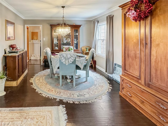 520 N Main St, Louisiana, MO 63353 - dining space featuring dark wood finished floors, ornamental molding, baseboards, and a chandelier