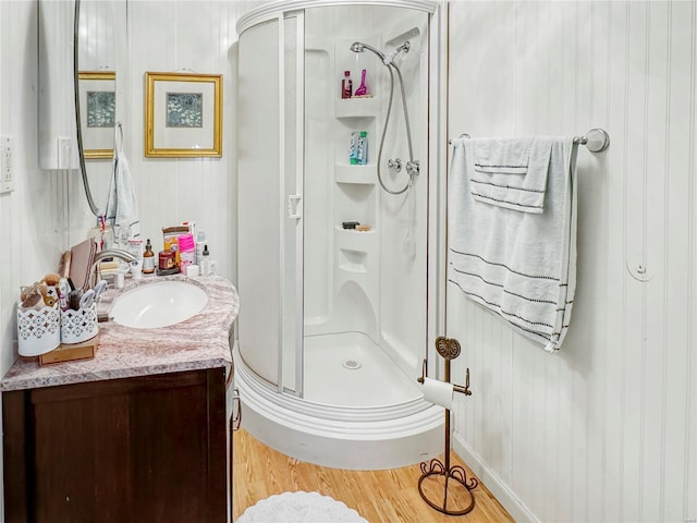 520 N Main St, Louisiana, MO 63353 - bathroom with a stall shower, wood finished floors, and vanity