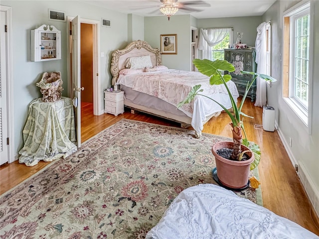 520 N Main St, Louisiana, MO 63353 - bedroom with wood finished floors and a ceiling fan