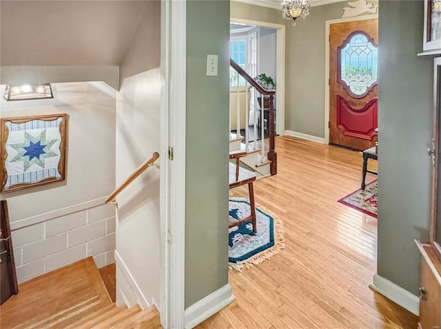 520 N Main St, Louisiana, MO 63353 - entrance foyer with stairway, wood finished floors, crown molding, a chandelier, and baseboards