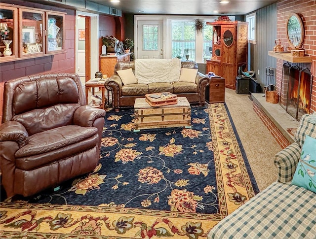 520 N Main St, Louisiana, MO 63353 - living area with a fireplace and carpet floors