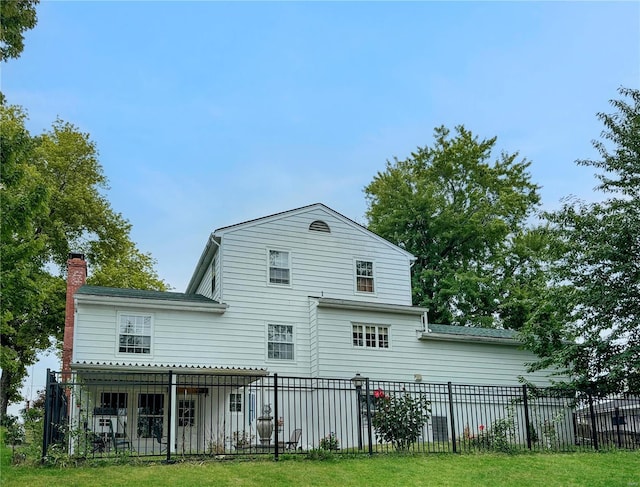 520 N Main St, Louisiana, MO 63353 - rear view of property with fence and a chimney