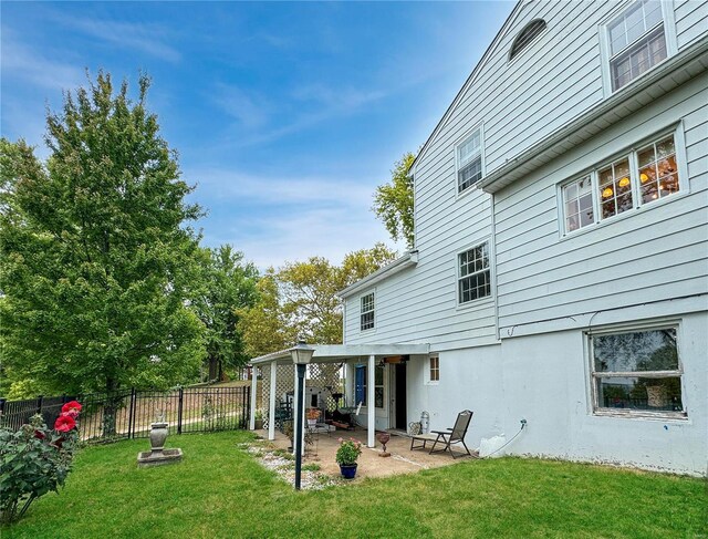 520 N Main St, Louisiana, MO 63353 - back of house featuring a patio area