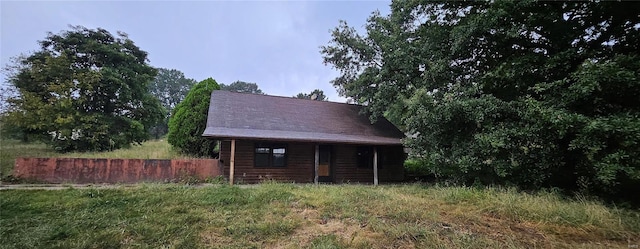 view of outbuilding with fence
