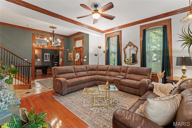 3623 Ohio Ave, Saint Louis, MO 63118 - living room featuring hardwood / wood-style floors, stairway, ceiling fan, crown molding, and a chandelier