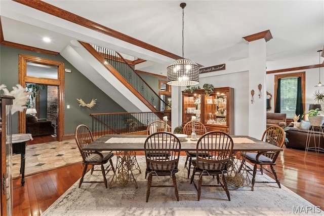3623 Ohio Ave, Saint Louis, MO 63118 - dining space featuring wood-type flooring, stairs, and recessed lighting