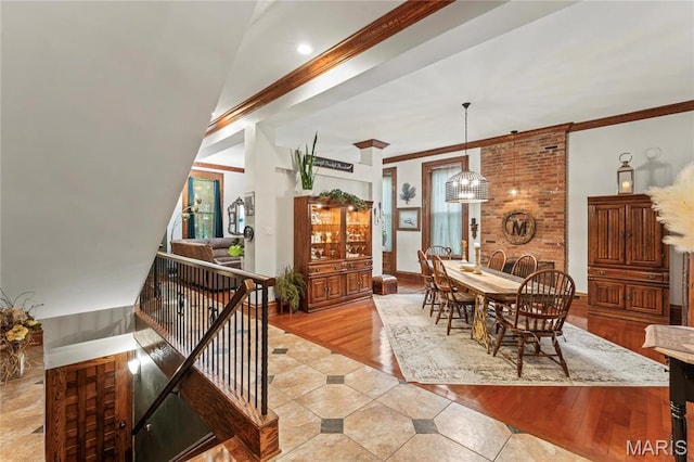 3623 Ohio Ave, Saint Louis, MO 63118 - dining area with light tile patterned floors, crown molding, and a chandelier
