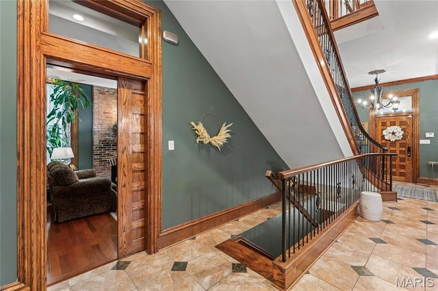 3623 Ohio Ave, Saint Louis, MO 63118 - staircase featuring tile patterned flooring and a chandelier