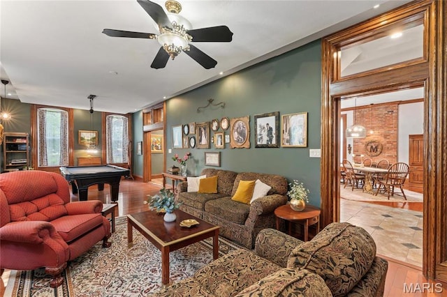 3623 Ohio Ave, Saint Louis, MO 63118 - living area with pool table, ceiling fan, and wood finished floors