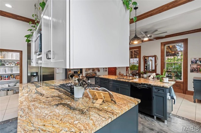3623 Ohio Ave, Saint Louis, MO 63118 - kitchen with stainless steel appliances, a peninsula, light tile patterned flooring, ceiling fan, and light stone counters