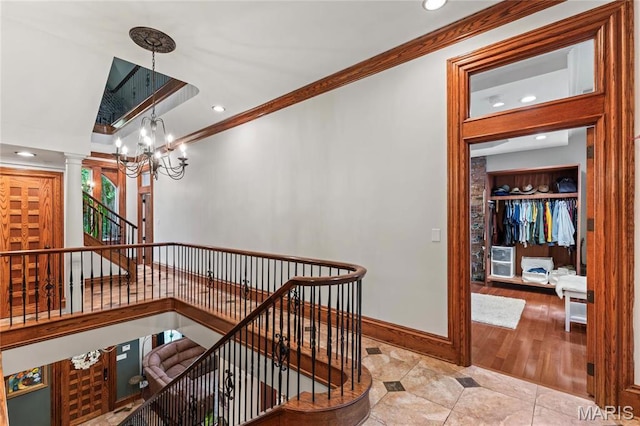 3623 Ohio Ave, Saint Louis, MO 63118 - staircase featuring ornamental molding, a chandelier, ornate columns, tile patterned floors, and recessed lighting