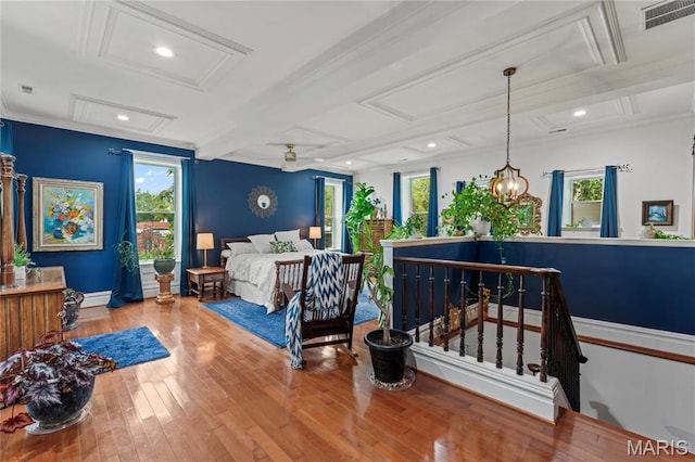3623 Ohio Ave, Saint Louis, MO 63118 - bedroom with attic access, wood-type flooring, multiple windows, coffered ceiling, and beamed ceiling