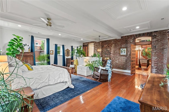 3623 Ohio Ave, Saint Louis, MO 63118 - bedroom featuring attic access, brick wall, wood finished floors, beamed ceiling, and ornamental molding