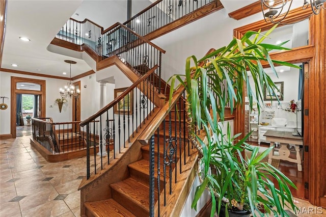 3623 Ohio Ave, Saint Louis, MO 63118 - staircase featuring a chandelier, crown molding, tile patterned flooring, a towering ceiling, and recessed lighting