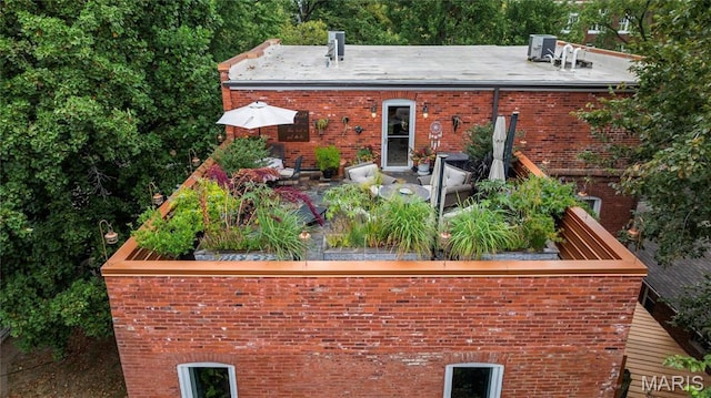 3623 Ohio Ave, Saint Louis, MO 63118 - back of property with brick siding and a patio area