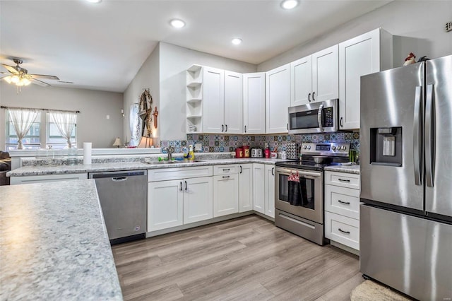 310 Crane St, Park Hills, MO 63601 - kitchen with stainless steel appliances, a sink, open shelves, a ceiling fan, and white cabinetry