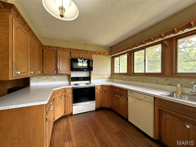 16347 Crestview Dr, Dexter, MO 63841 - kitchen with electric stove, dishwasher, black microwave, a sink, and a textured ceiling