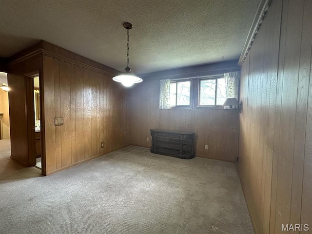 16347 Crestview Dr, Dexter, MO 63841 - carpeted empty room with wood walls and a textured ceiling