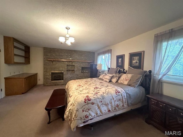 16347 Crestview Dr, Dexter, MO 63841 - carpeted bedroom with a chandelier, a textured ceiling, and a fireplace