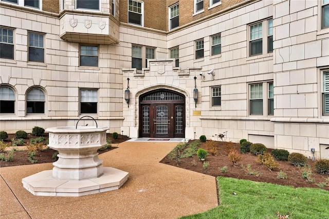 entrance to property with stone siding and french doors