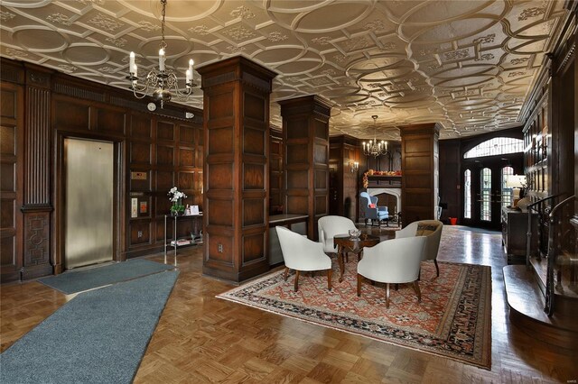 community lobby featuring an ornate ceiling and wooden walls