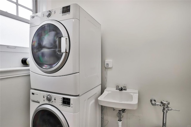washroom with estacked washer and dryer