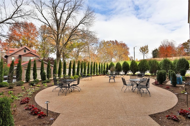 view of property's community featuring a patio and outdoor dining area