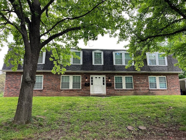 24 Gettysburg Rd, Belleville, IL 62226 - view of front facade with mansard roof, a front lawn, and brick siding