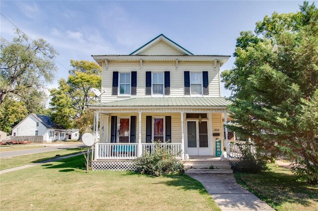 202 4th St, Carrollton, IL 62016 - view of front of property featuring a porch and a front yard