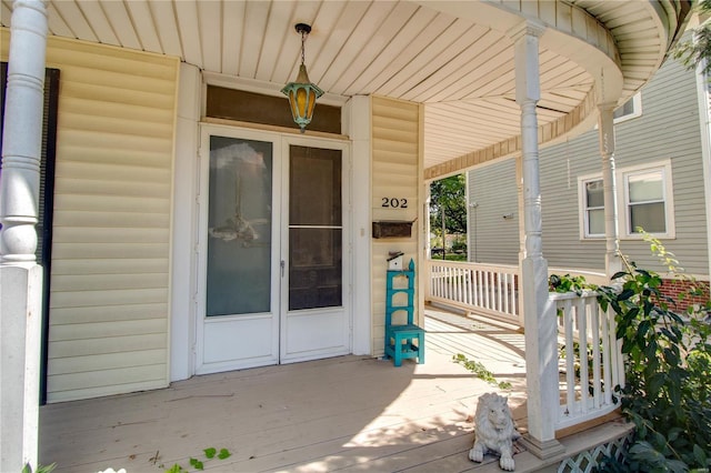 202 4th St, Carrollton, IL 62016 - wooden deck featuring covered porch