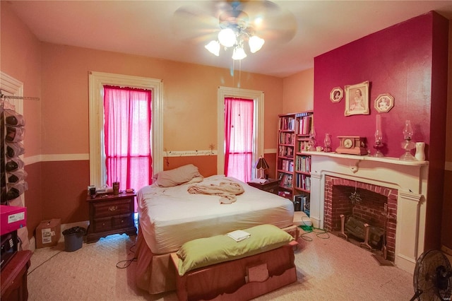 202 4th St, Carrollton, IL 62016 - carpeted bedroom with a brick fireplace and ceiling fan