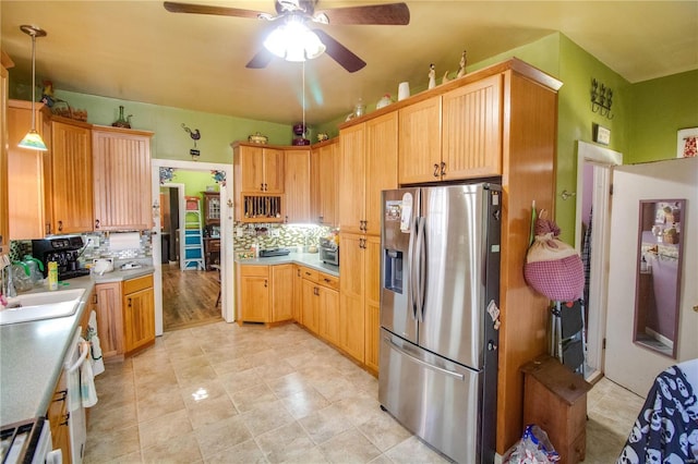 202 4th St, Carrollton, IL 62016 - kitchen featuring stainless steel fridge, a sink, ceiling fan, and light countertops