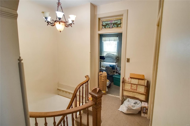 202 4th St, Carrollton, IL 62016 - corridor featuring carpet floors, a chandelier, and an upstairs landing