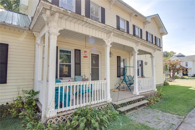 202 4th St, Carrollton, IL 62016 - entrance to property featuring a porch