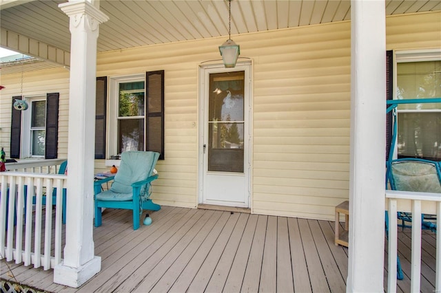 202 4th St, Carrollton, IL 62016 - wooden terrace with a porch