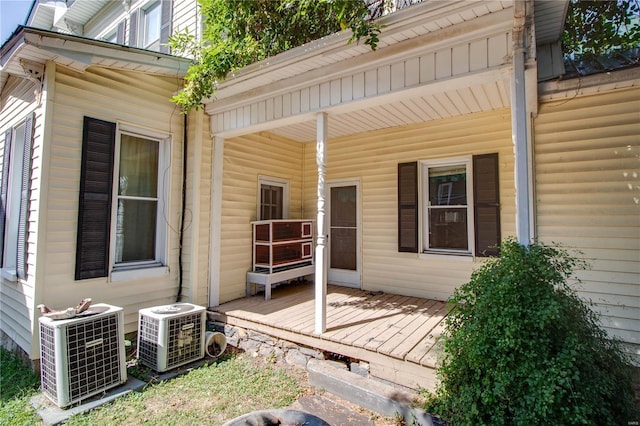 202 4th St, Carrollton, IL 62016 - back of property with central AC and a wooden deck
