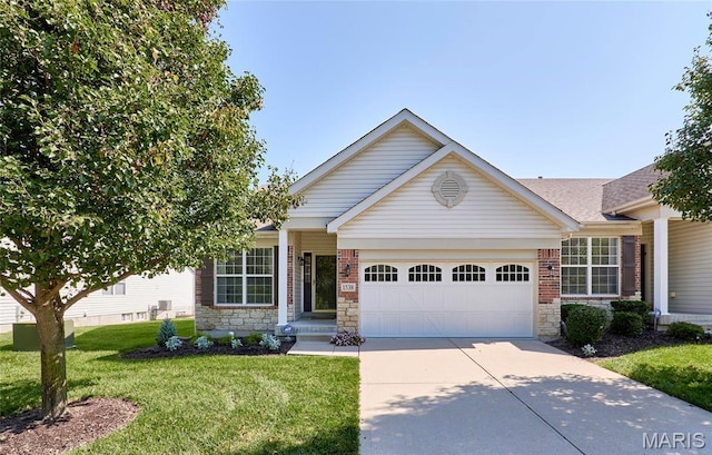 1538 Cattail Way, Saint Charles, MO 63303 - view of front of house with a garage, driveway, a front yard, and stone siding