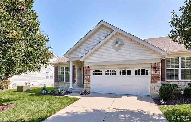 1538 Cattail Way, Saint Charles, MO 63303 - view of front of property with driveway, a garage, stone siding, a front yard, and a shingled roof