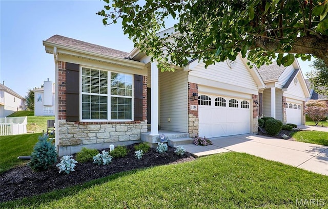 1538 Cattail Way, Saint Charles, MO 63303 - view of front of house featuring stone siding, concrete driveway, an attached garage, and a shingled roof
