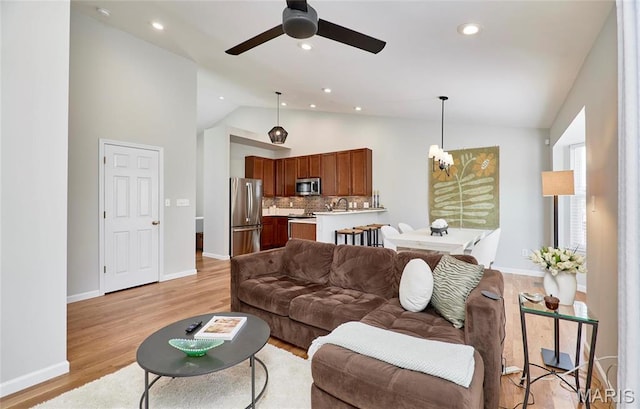 1538 Cattail Way, Saint Charles, MO 63303 - living area with a ceiling fan, baseboards, light wood finished floors, high vaulted ceiling, and recessed lighting