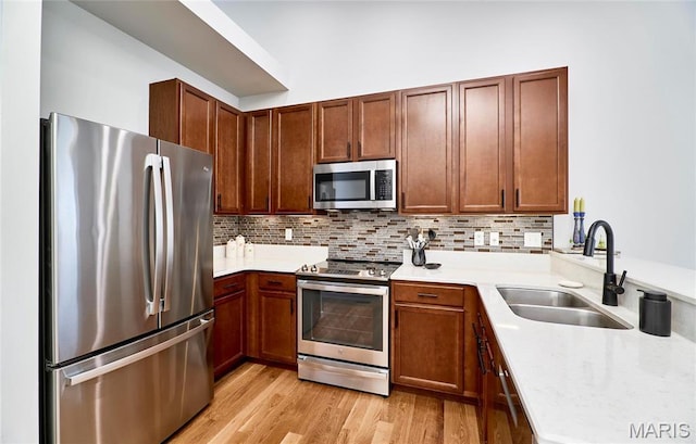 1538 Cattail Way, Saint Charles, MO 63303 - kitchen with stainless steel appliances, a sink, light countertops, and backsplash