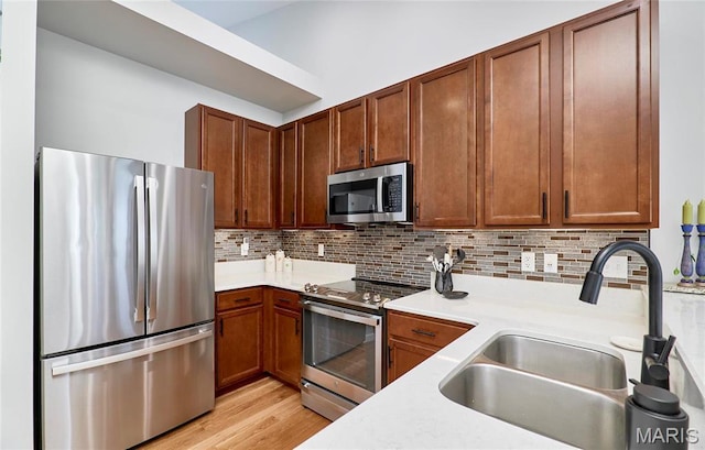1538 Cattail Way, Saint Charles, MO 63303 - kitchen with stainless steel appliances, a sink, light countertops, and backsplash