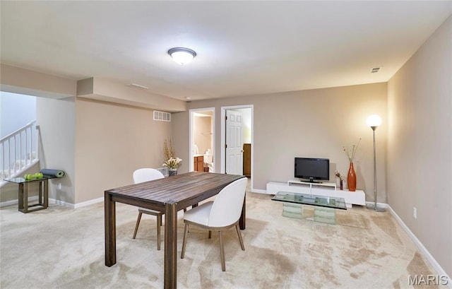 1538 Cattail Way, Saint Charles, MO 63303 - dining area featuring light colored carpet, stairs, and baseboards