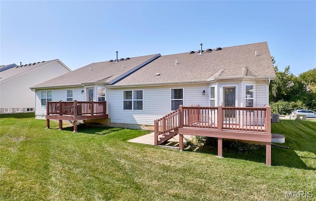 1538 Cattail Way, Saint Charles, MO 63303 - back of house featuring a wooden deck, a lawn, roof with shingles, and central AC unit