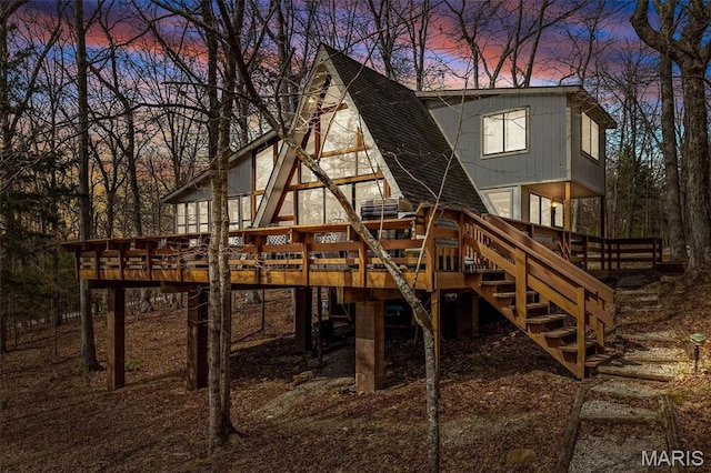 682 Shadow Lake Circle Dr, Innsbrook, MO 63390 - playground at dusk with stairs and a deck