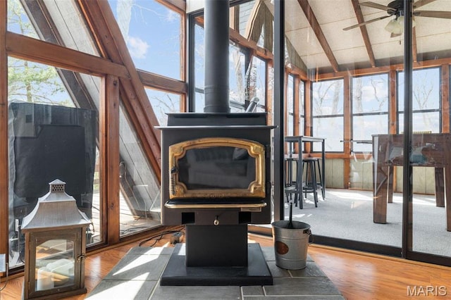 682 Shadow Lake Circle Dr, Innsbrook, MO 63390 - sunroom featuring a wood stove and wood finished floors