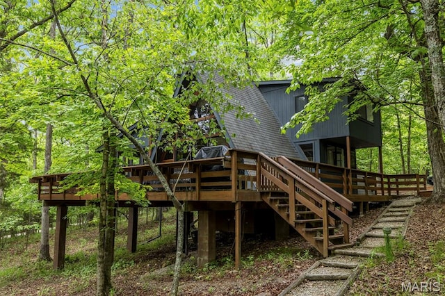 682 Shadow Lake Circle Dr, Innsbrook, MO 63390 - rear view of house featuring a wooden deck, stairs, and roof with shingles